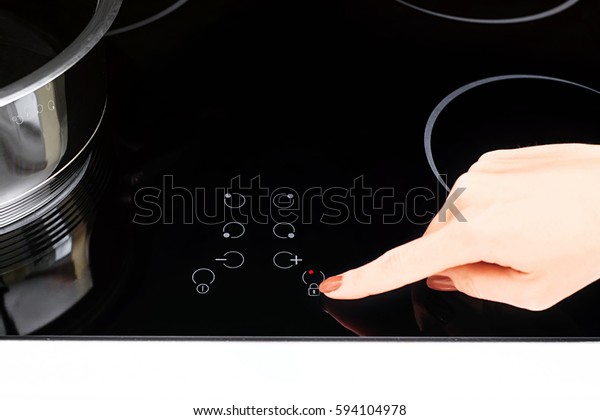 Female Hand Turns On Electric Hob Stock Photo Edit Now 594104978