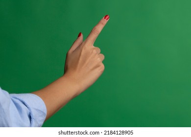 Female hand wearing red nail polish, performing single click screen gesture. 