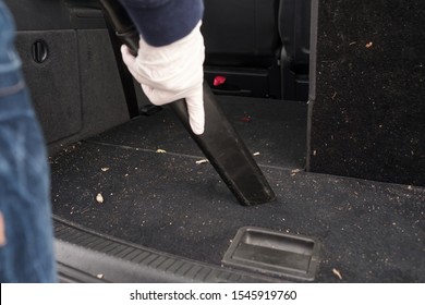 Female Hand In White Gloves Hoovering A Car Cabin From Dust