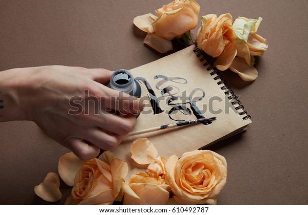 Female Hand Writing Love Word On Stock Photo (Edit Now) 610492787