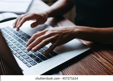 Female Hand Writing Something On The Laptop Keyboard