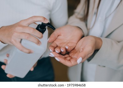 Female hands applying antibacterial liquid soap close up. - Shutterstock ID 1975984658