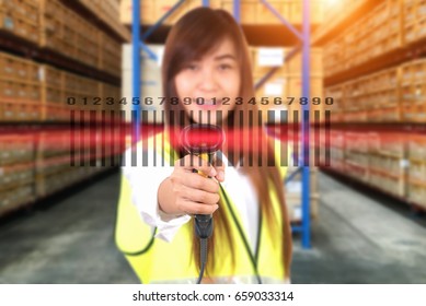 female hands with bar code scanner scanning  in a warehouse. 