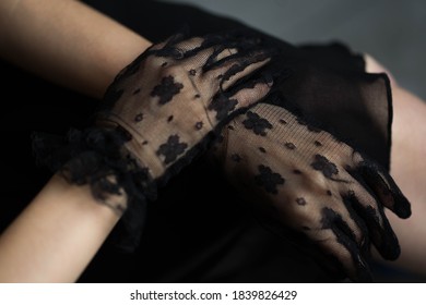 Female Hands In Black Lace Gloves