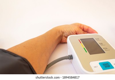 Female hands with blood-pressure meter isolated over white - Shutterstock ID 1894584817