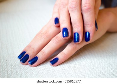 Female Hands With Blue Nails