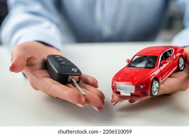 Female hands hands and car schematic as an example of insurance. car concept protection. - Powered by Shutterstock