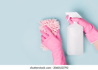 Female hands cleaning on blue background. Cleaning or housekeeping concept background. Copy space.  Flat lay, Top view.