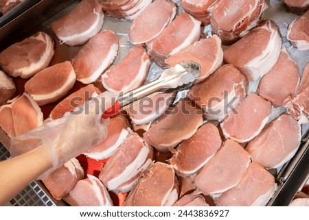 Similar – Delicious sausages on a supermarket fridge shelf