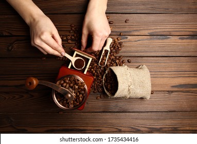 A Female  Hands And Coffee Grinder