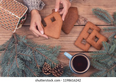 Female Hands Collect Gingerbread House, Top View