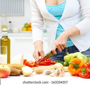 Female hands cooking healthy dinner at kitchen - Shutterstock ID 163334357