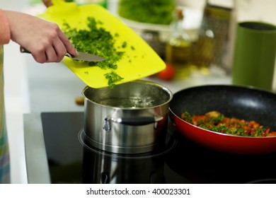 Female Hands Cooking On Kitchen With Pan, Closeup