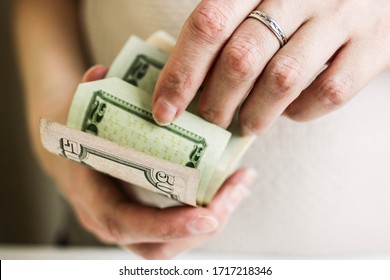 Female Hands Counting Us Dollars. Woman Hand Count The United States Currency. A Bunch Of American Banknotes. The World Currency Is The US Dollar. 10 And 20 Dollars Counted By A Woman.