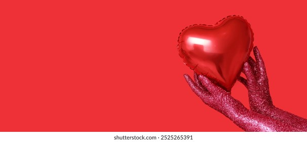 Female hands covered with glitters and heart-shaped balloon on red background with space for text. Valentines Day celebration - Powered by Shutterstock