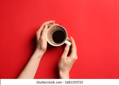 Female Hands With Cup Of Hot Coffee On Color Background