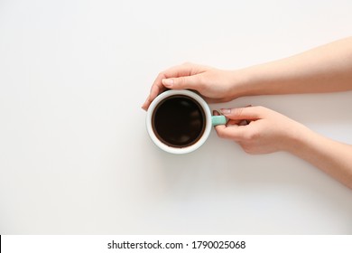 Female Hands With Cup Of Hot Coffee On Light Background, Top View