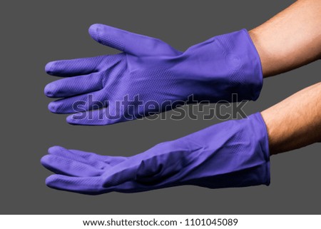 Female hands with disposable latex gloves wearing gesture, selective focus.