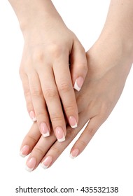 Female hands with french manicure isolated on white background