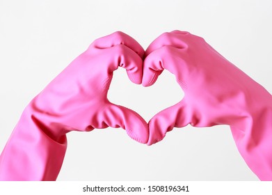Female hands in gloves in the shape of a heart on light background, cleaning concept - Shutterstock ID 1508196341