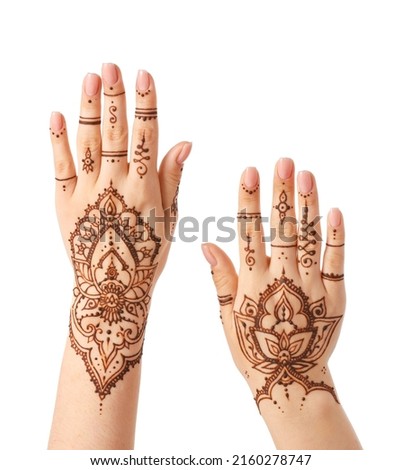 Female hands with henna tattoo isolated on white background, closeup