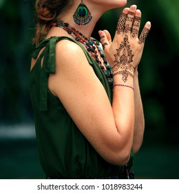 Female Hands With Henna Tattoo Praying. Beautiful Indian Mehendi Ornaments Painted On A Body Part