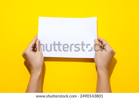 Similar – Image, Stock Photo Hand holding a handmade hairpin with miniature clay cookie