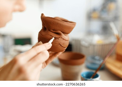 Female hands hold a bowl for casting clay products. Shaped method for making clay dishes. Handwork. Pottery making - Powered by Shutterstock