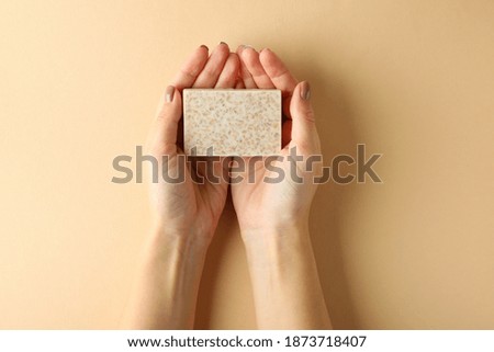 Similar – Image, Stock Photo Hand holding a handmade hairpin with miniature clay cookie