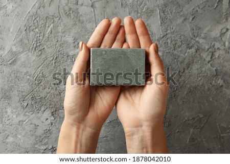 Similar – Image, Stock Photo Hand holding a handmade hairpin with miniature clay cookie