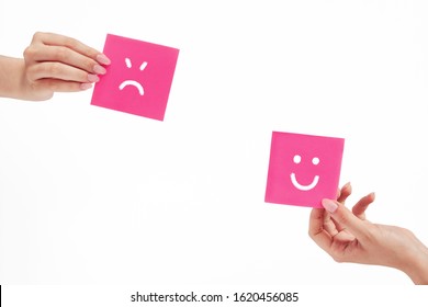 Female Hands Hold Notes With Painted Emoticons, The Concept Of A Good And Bad Day, Mood, Work