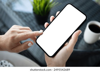 female hands hold phone with isolated screen background of cafe in office
