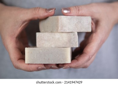 Female Hands Hold A Stack Of Homemade Handmade Soap. Sandalwood Scent. Small Business, Organic Products, Natural Ingredients.