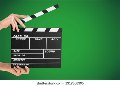 Female hands holding a clapboard on white background. Slate movie
    
    - Image - Shutterstock ID 1319538395