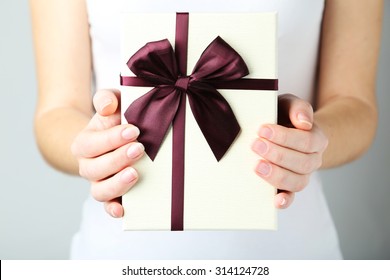 Female Hands Holding Gift Box