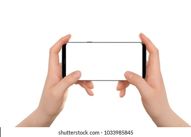 Female Hands Holding Modern Black Phone In Horizontal Position. Isolated Hands And Smartphone On White Background.