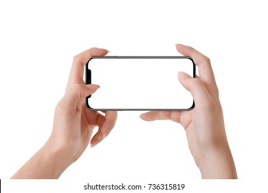 Female Hands Holding Modern Black Phone In Horizontal Position, Isolated On White Background