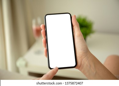 Female Hands Holding Phone With Isolated Screen In The House In Room