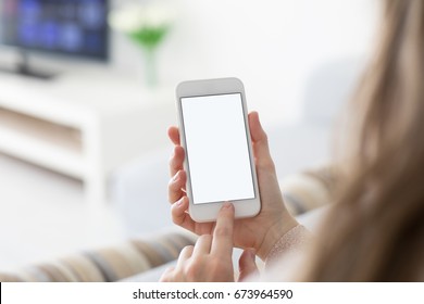 Female Hands Holding Phone With Isolated Screen In  Room
