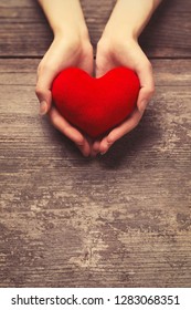 Female Hands Holding Red Heart