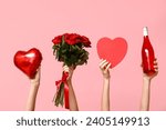 Female hands holding roses, bottle of wine, heart-shaped balloon and gift box on pink background. Valentine