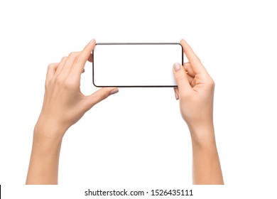 Female hands holding smartphone with blank screen taking photo, isolated on white background, free space
