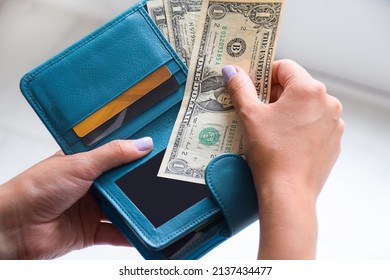 Female Hands Holding Wallet With US American Cash Money