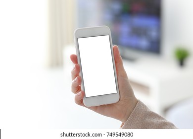 Female Hands Holding White Phone With Isolated Screen In Home Room