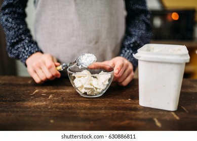 Female Hands Holds Spoon With Margarine Over Bowl