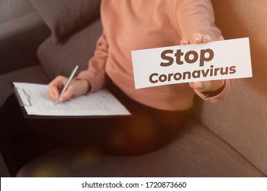 In Female Hands The Inscription Remain Covert 19. Coronavirus Pandemic Concept.