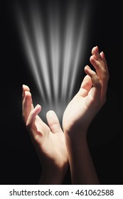 Female hands with light on dark background - Shutterstock ID 461062588
