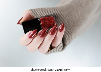 Female Hands With Long Nails And Dark Red Nail Polish