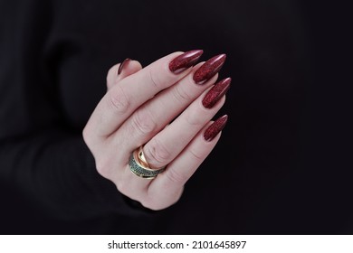 Female Hands With Long Nails And Dark Red Nail Polish