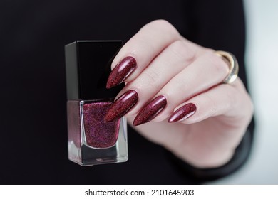 Female Hands With Long Nails And Dark Red Nail Polish